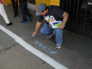 James chalks a hashtag along the HWL.  