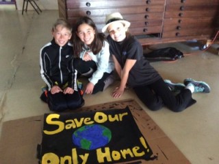 Ian, Collette and Ania with the poster they designed and painted.