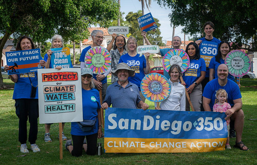 Policy Team - group of people holding protest signs.