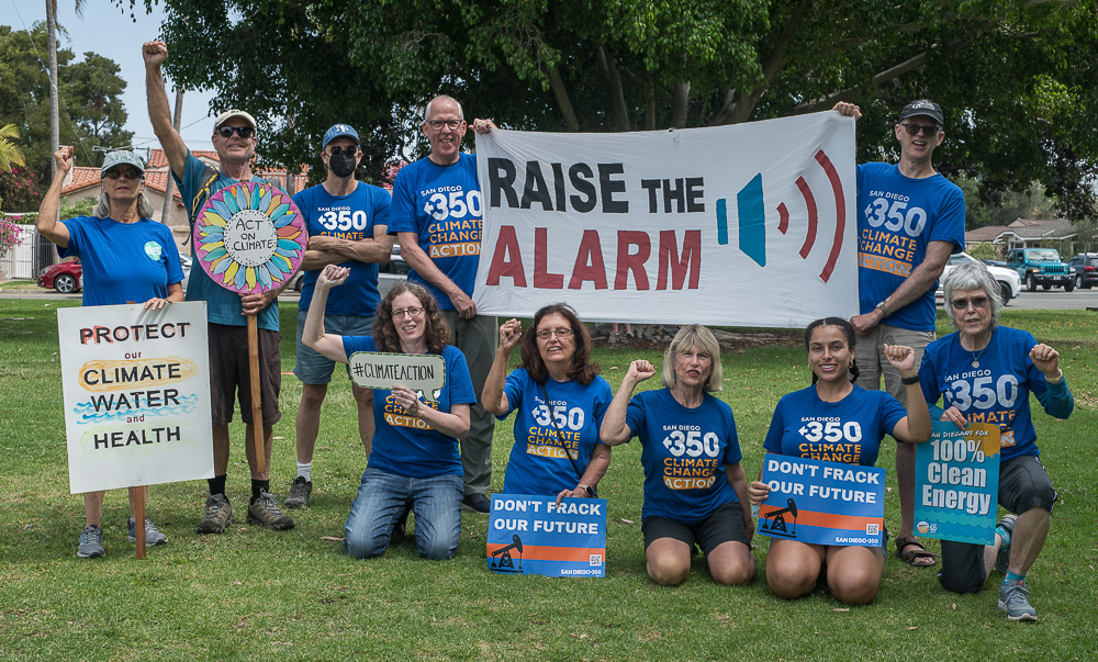 Group of SanDiego350 members holding signs calling for climate action