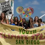 Youth holding signs and banners