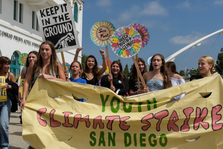 Youth holding signs and banners