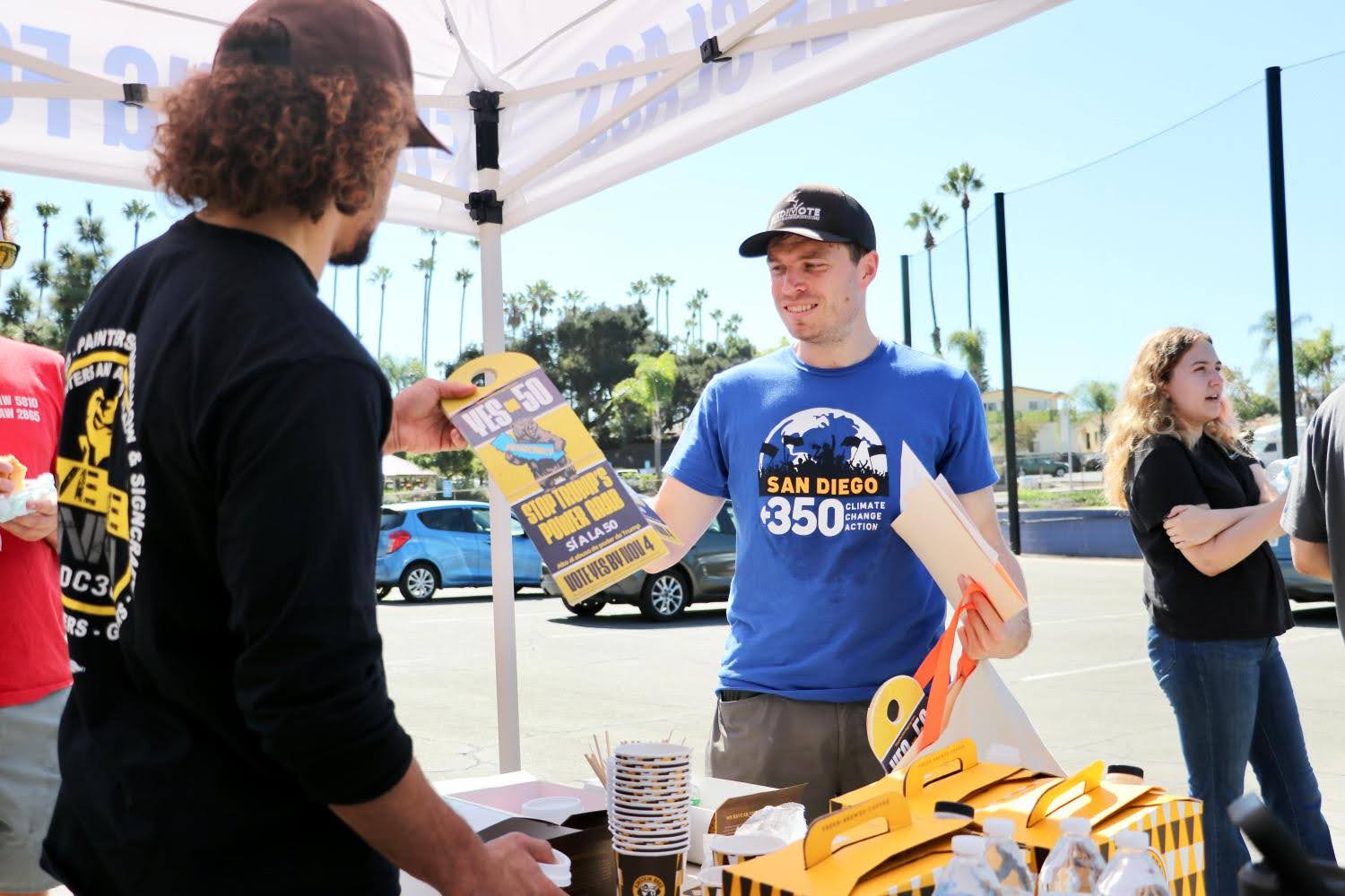 Person handing out flyer