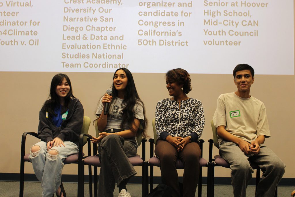 4 speakers sitting on chairs