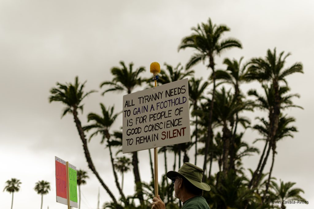 Person holding protest sign